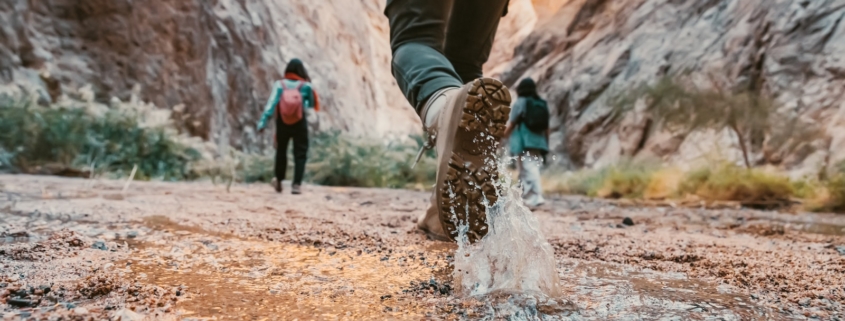 a couple of people that are walking in the dirt